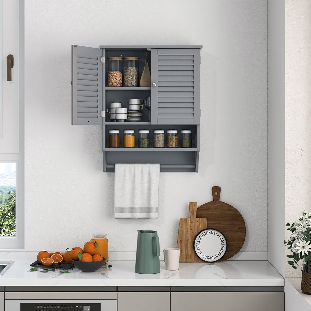Grey wall cabinet with two doors, open to reveal shelves stocked with jars and cups