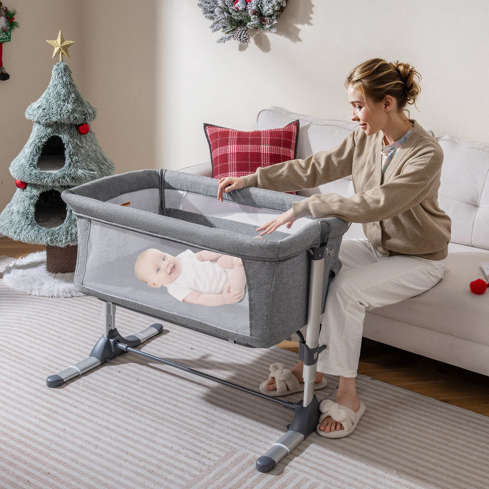 The grey bedside sleeper in a living room with a Christmas tree