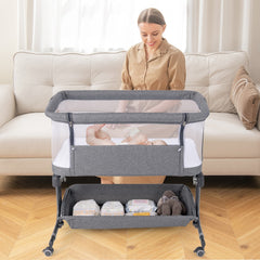 The bedside sleeper in a living room with a baby inside and a woman nearby