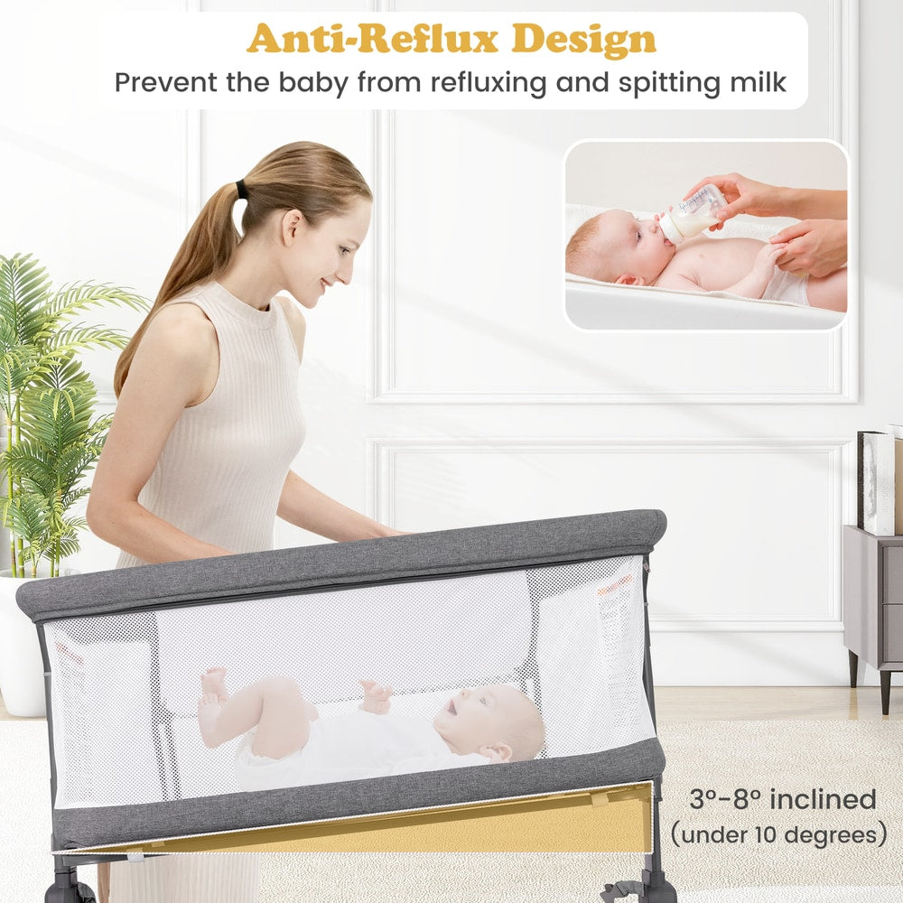 Close up of the grey bassinet bedside sleeper with a baby inside, showing the anti-reflux design