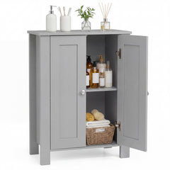The grey floor cabinet with double doors open showing toiletries and a basket on the shelf