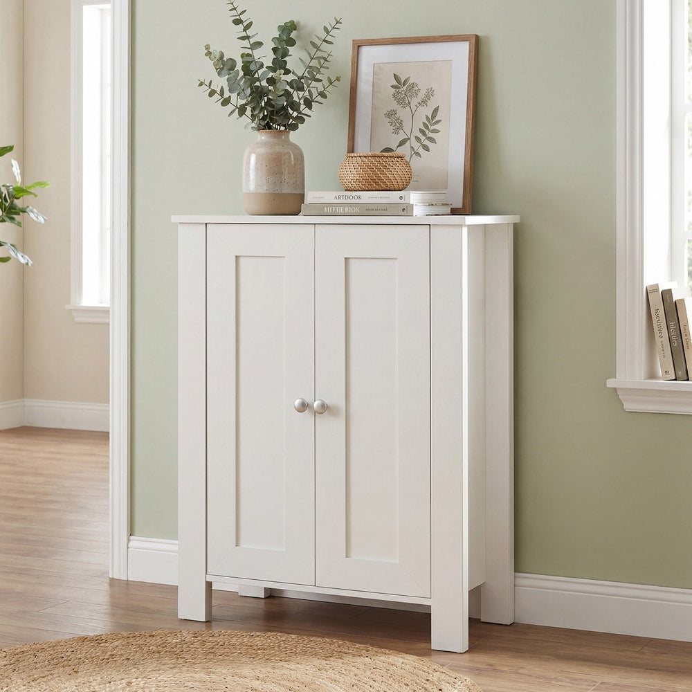 White wooden cabinet with double doors, set against a light green wall in a hallway