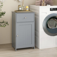 The floor cabinet standing next to a white washing machine in a neutral bathroom setting