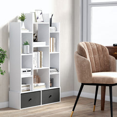 The white wooden bookcase with twelve tiers and two drawers, placed in a study room with a chair