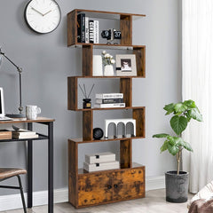 A rustic brown bookcase with cabinet against a grey wall, styled with books and decorative items