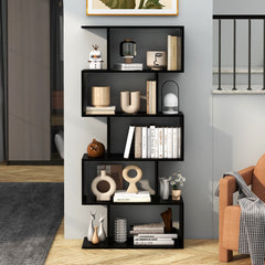 The geometric S-shaped bookcase in a modern living room next to a sofa and armchair