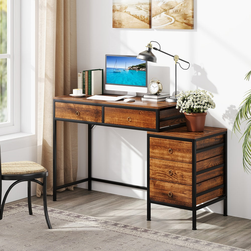 Rustic brown wood effect computer desk with drawers and side cabinet in a home office setting