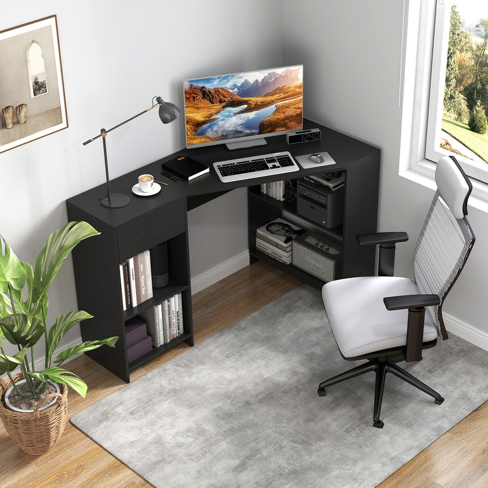 Black L-shaped computer desk with open shelves, set up in a modern living room with a chair and plant