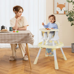 The high chair in use by a toddler sitting at a dining table next to an adult