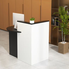 The black and white reception counter desk in a modern office setting