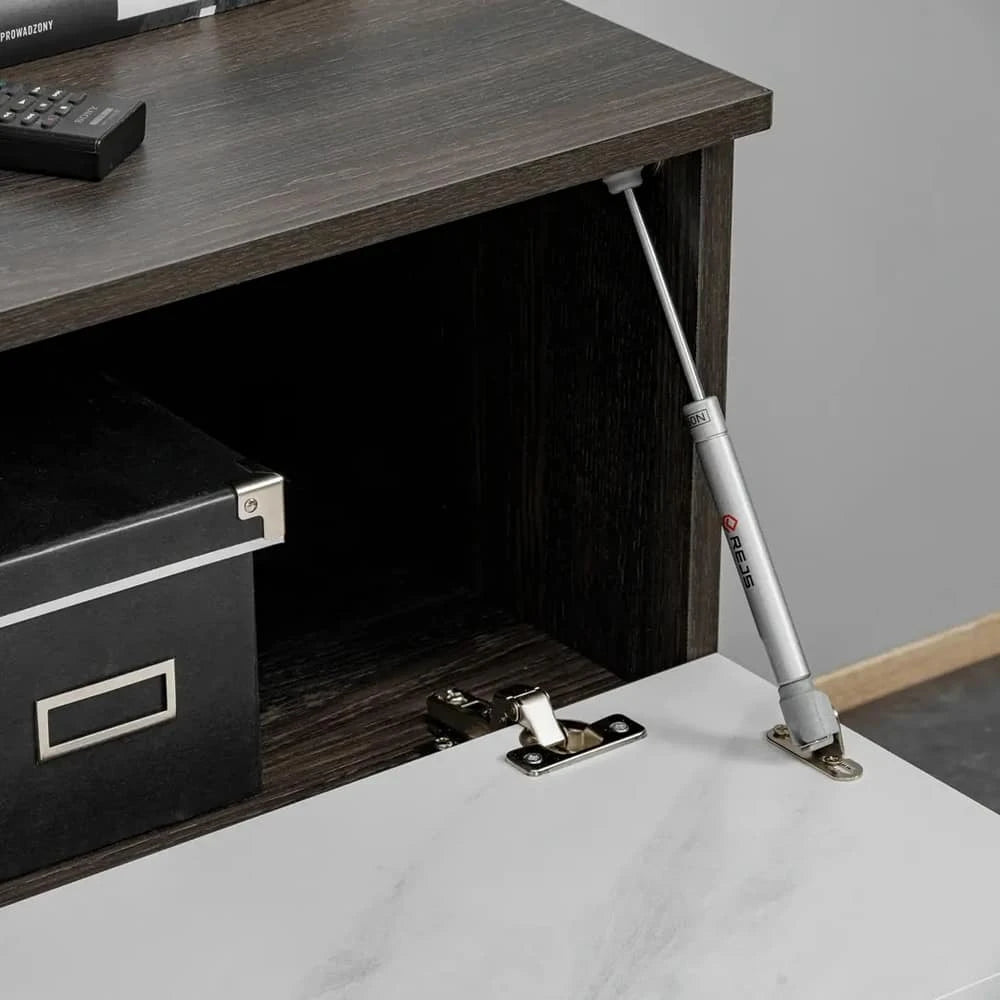 The entertainment unit cabinet door is held open by a metal gas strut mechanism for easy access