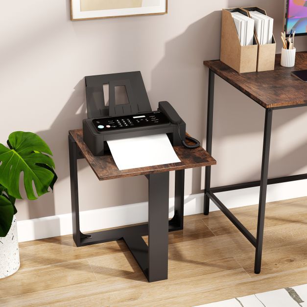 The rustic brown side table holding a fax machine