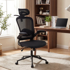 The office chair placed next to a wooden desk with a laptop and books
