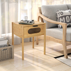 A single farmhouse bedside table nightstand next to a sofa