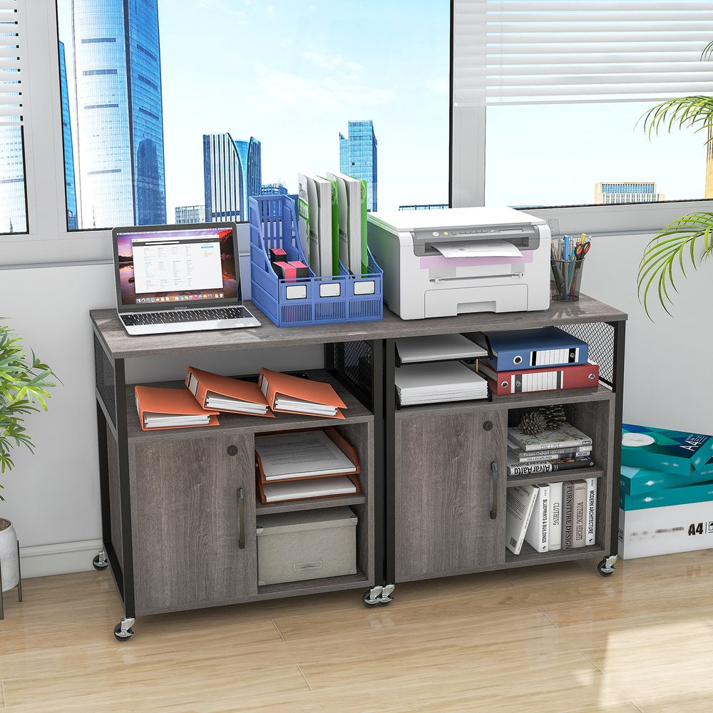 Two file cabinets placed side by side to create a larger storage unit under a window