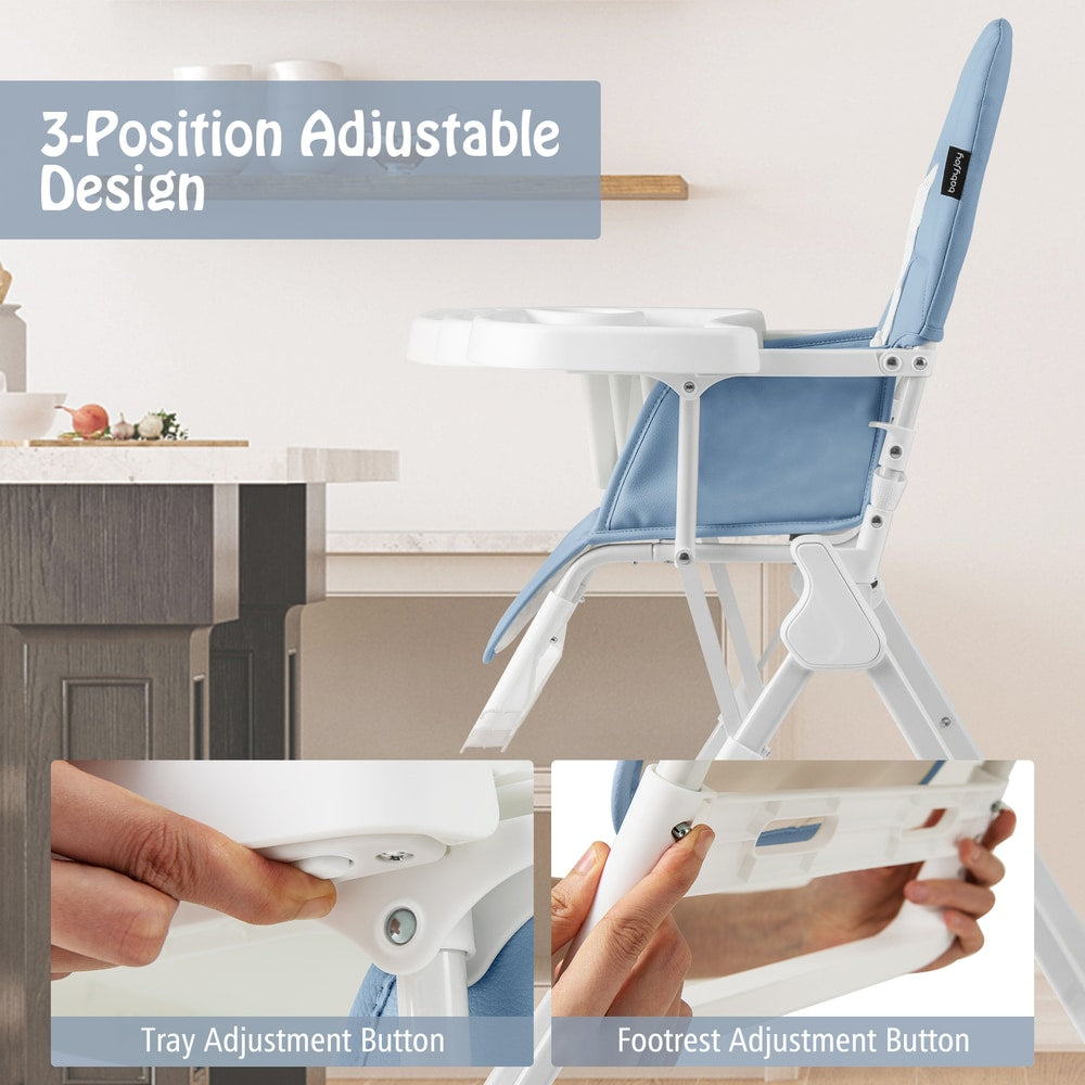 Close up of the tray adjustment button and footrest adjustment button on the high chair