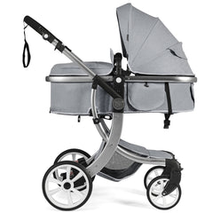 The grey baby stroller with the bassinet attached, showing the wheels and frame