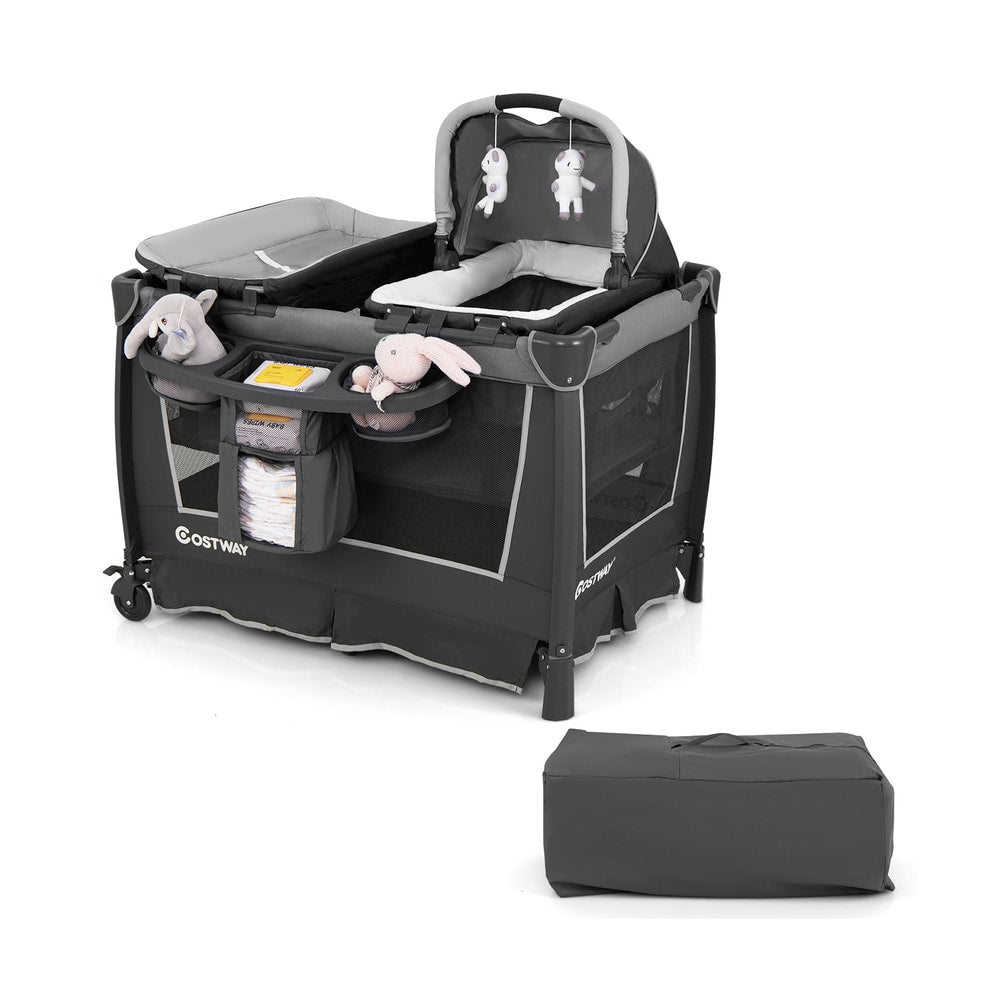 Foldable pack and play with removable bassinet and changing table, next to its storage bag