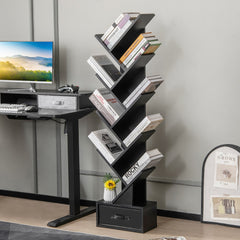 The black tree bookshelf with drawer is placed next to a desk with a computer