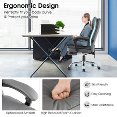 The office chair in use by a person with close-up details of the armrest and seat cushion