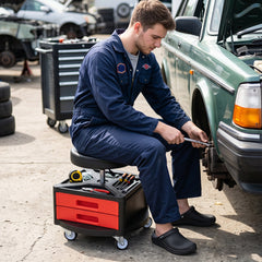Rolling stool being used to repair the side of a car