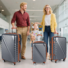 Family with a child standing with the grey camping suitcases in an airport terminal