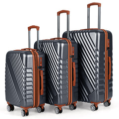 Three grey camping suitcases with brown handles and wheels arranged in a row