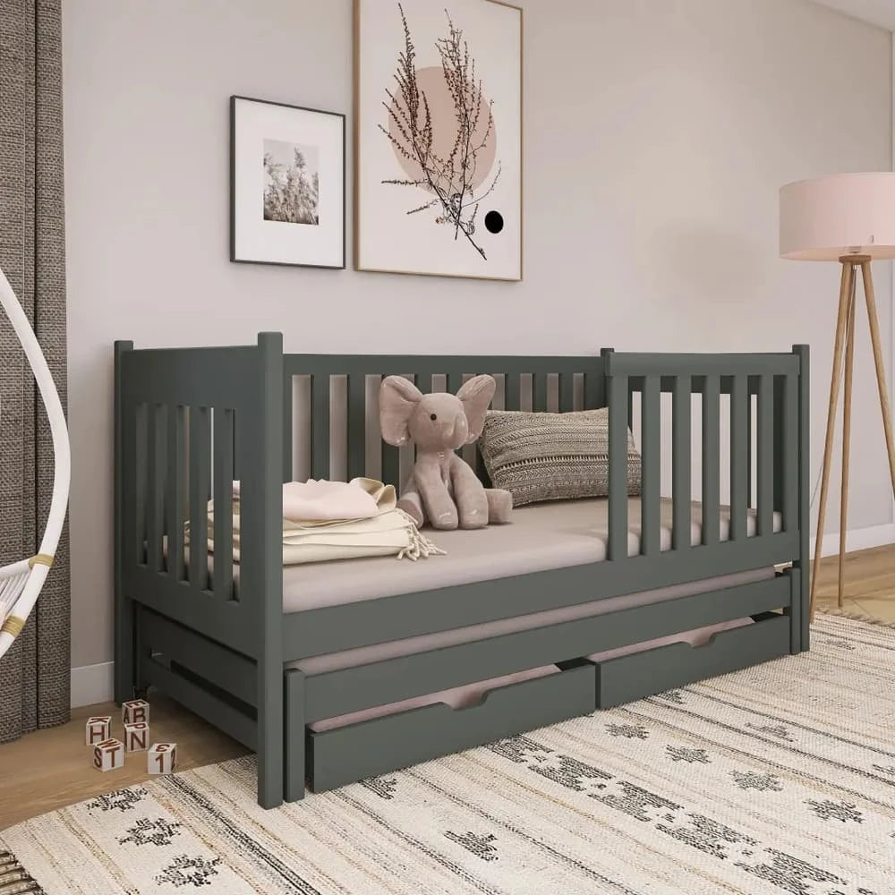 The dark grey kids single bed with two storage drawers in a bedroom setting