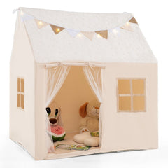 The fabric playhouse with star lights and soft toys inside the open front entrance