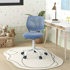 The kids chair positioned in a child's bedroom with a desk and teddy bears in the background