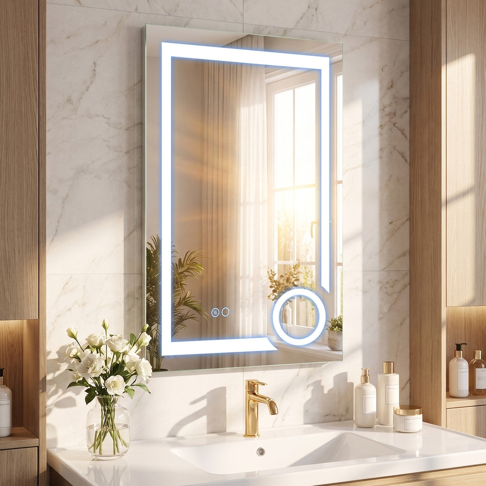 The illuminated bathroom mirror glowing with cool white light above a sink