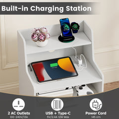 The bedside tables featuring a close up of the charging station with plugs and USB ports