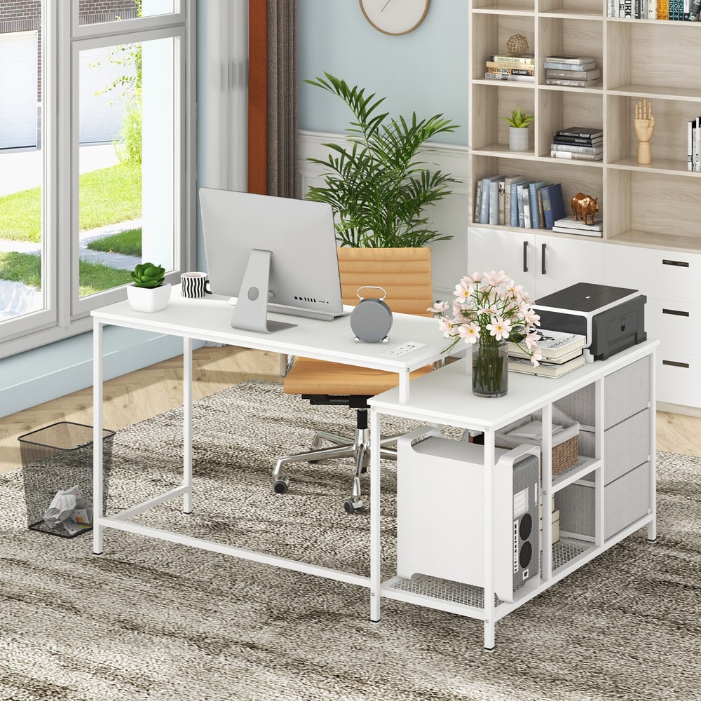 The office desk positioned in a home study with a chair and bookshelf in the background