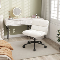 The office chair positioned in front of a white dressing table in a bedroom setting