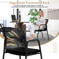 Close-up of the ergonomic mesh backrest on a black office chair, showing airflow