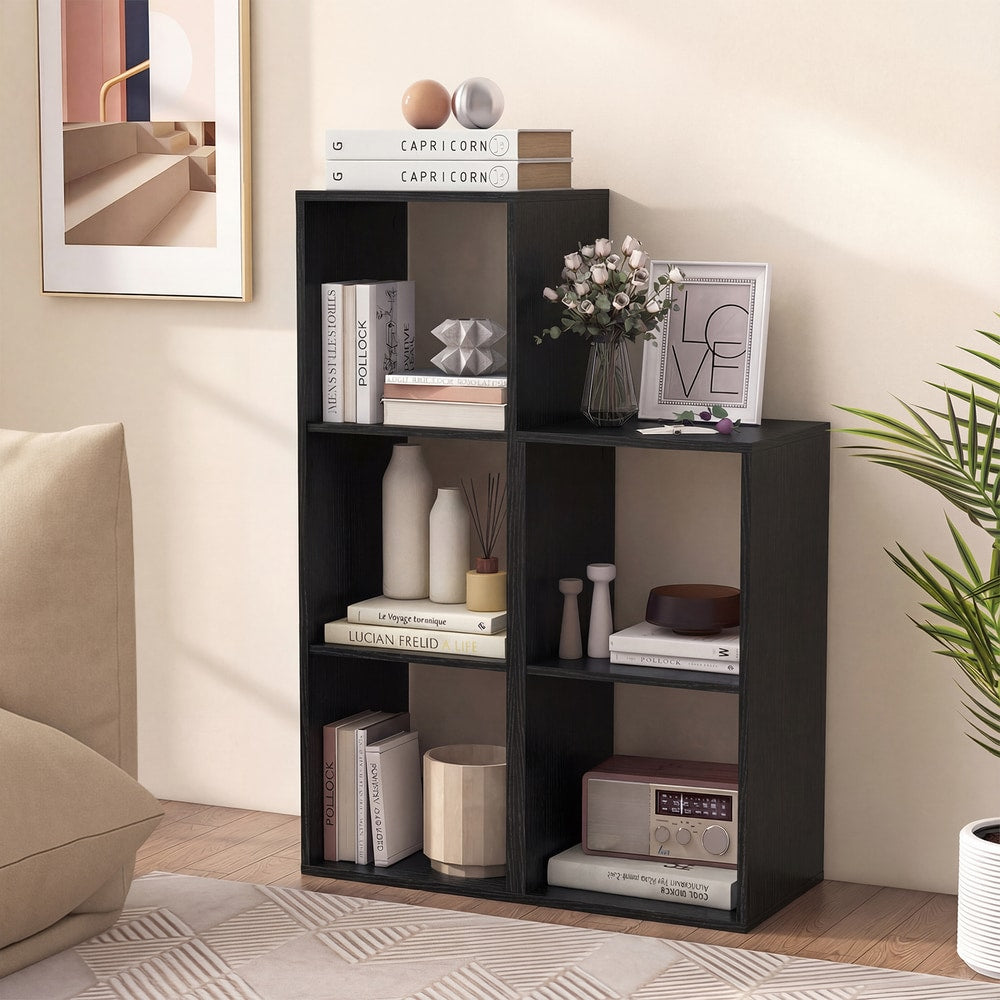 Several black two-tier bookcases arranged to form a larger shelving unit