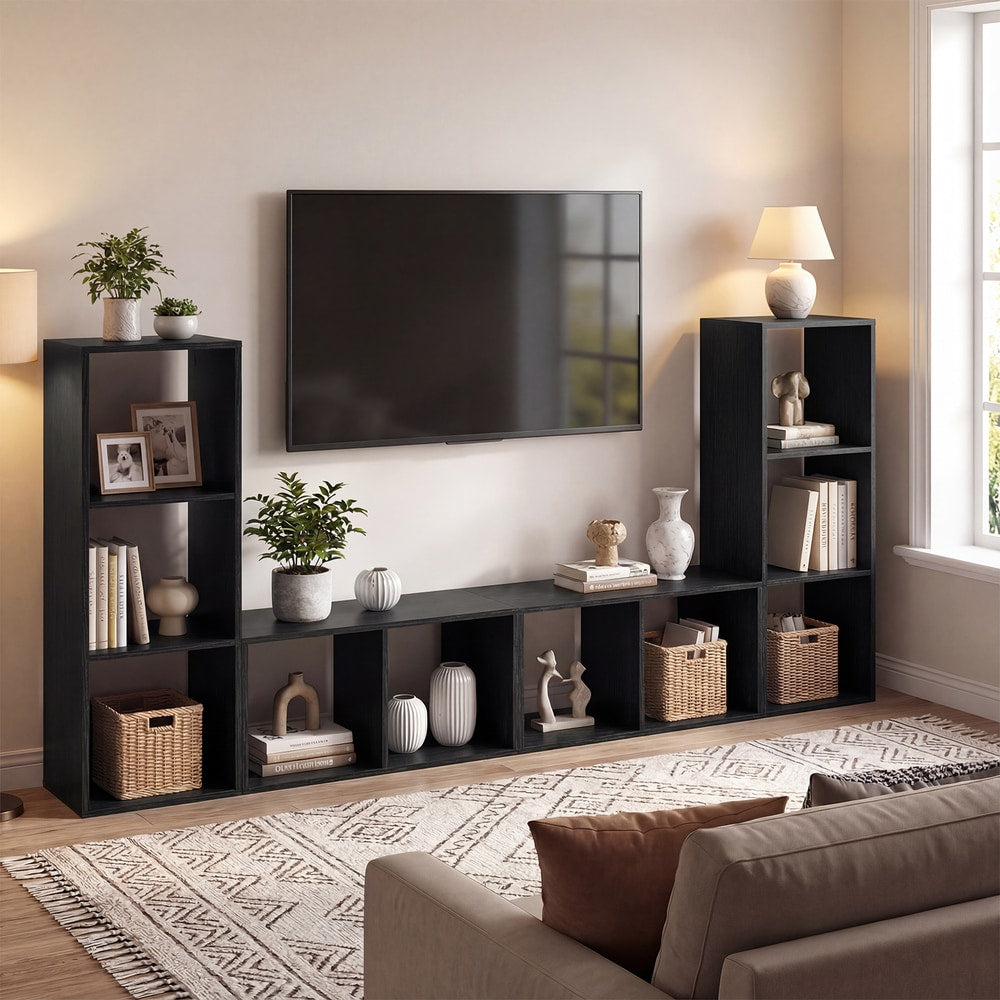 The black two-tier bookcase as part of a media unit with a television and sofa