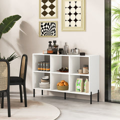 The white storage bookcase is used as a drinks cabinet in a dining room setting