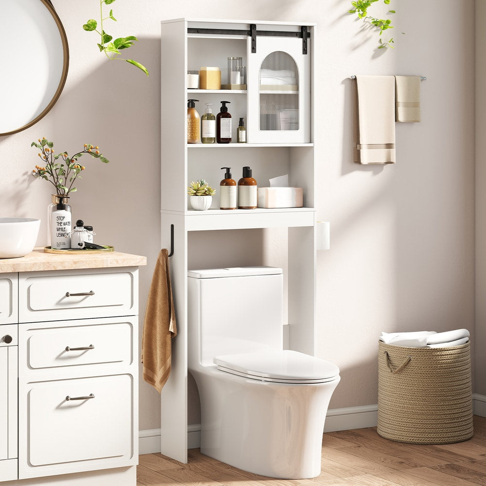The storage unit positioned over a toilet in a bright bathroom with toiletries on the shelves