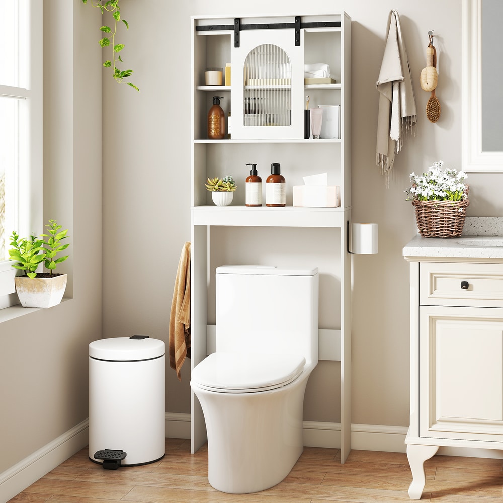 The cabinet placed over a toilet with various bathroom accessories displayed on the open shelves