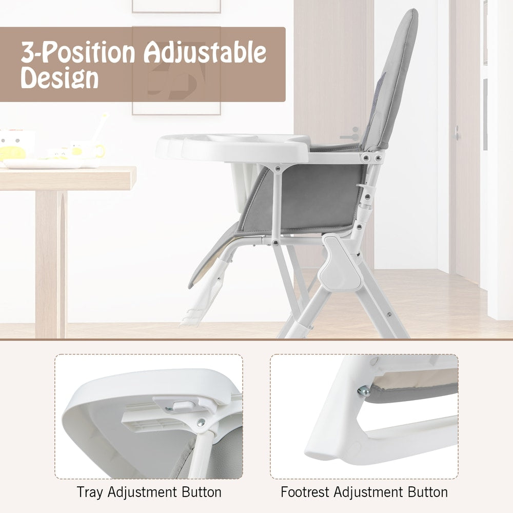 Close-up of the tray and footrest adjustment buttons on the grey portable high chair