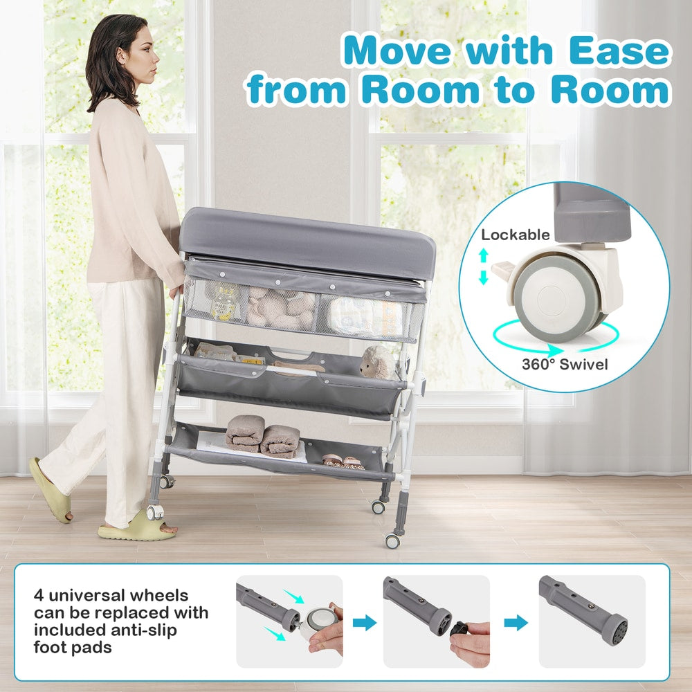 The changing table being moved on wheels with close-ups of the lockable swivel mechanism