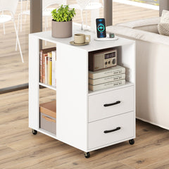 White bedside table with two drawers and open shelves, shown with books and a plant