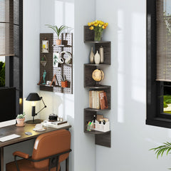 The bookcases installed on a wall corner next to a desk with a computer and pegboard