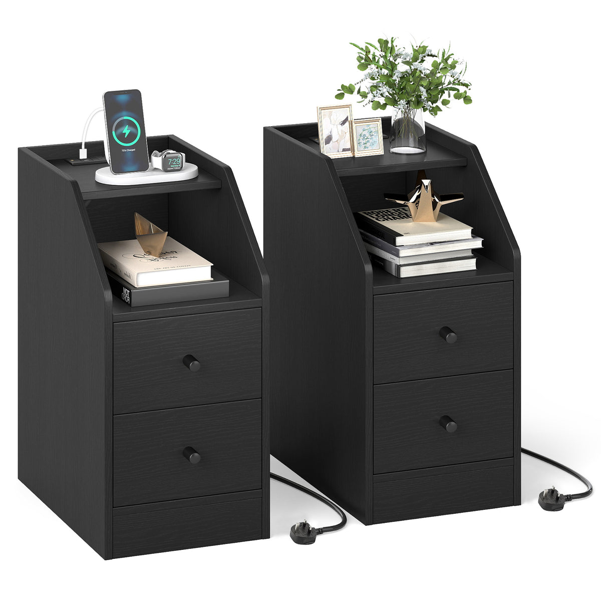 The black side tables styled with books, a plant and charging devices on the top shelf