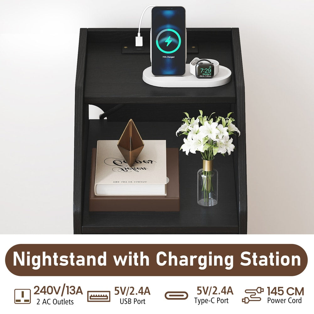 The top shelf of the side table with a phone and watch charging on the integrated station