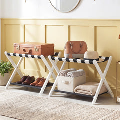 Two luggage stands are arranged in a room, one holding shoes and the other storage baskets