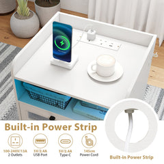 Close up of the built-in power strip on the white bedside table with USB ports