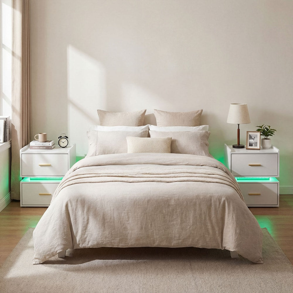 Pair of white nightstands with drawers and LED lighting, positioned at either side of a bed