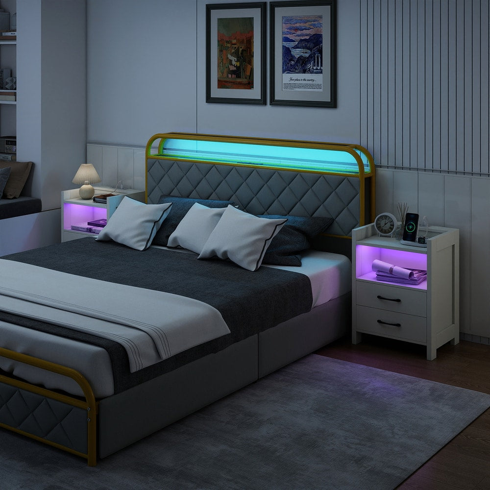 The nightstands placed on either side of a modern bed in a dimly lit bedroom setting